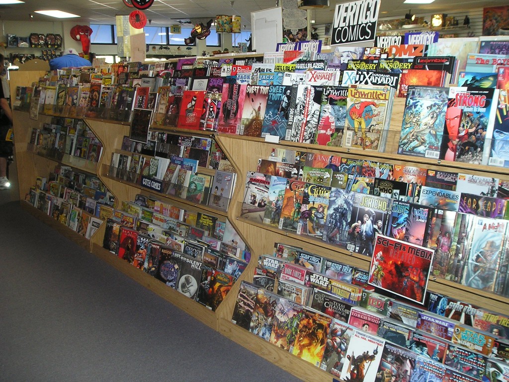 about time warp comics - comic racks have signage to help point out areas of interest